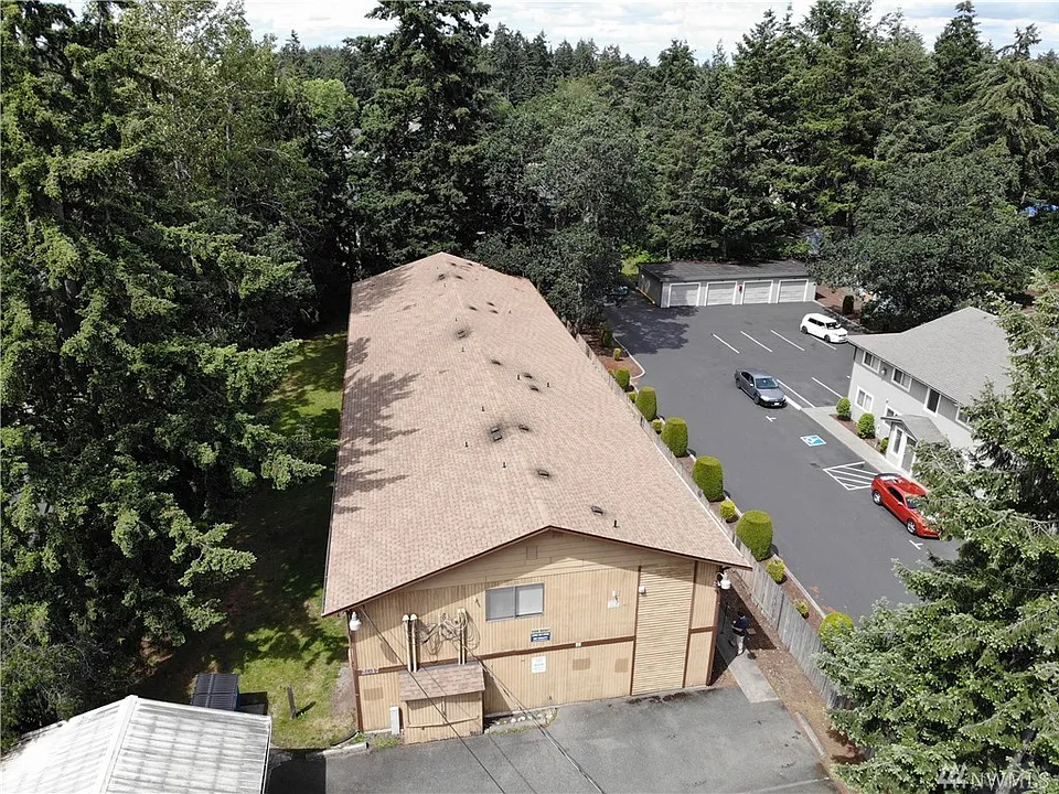 This complex is tucked in among mature trees.