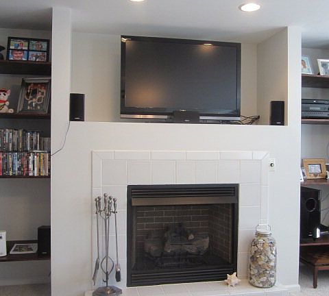 Gas fireplace with entertainment center built-in above.