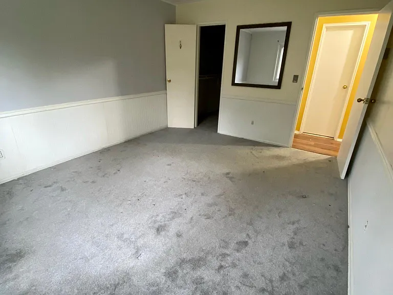Very spacious Bedroom with new carpeting, decorative finishes, and walk in closet.