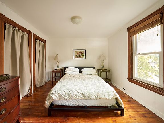 the bedroom with 2 closets