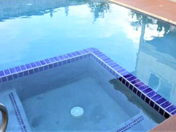 Pool with hot tub