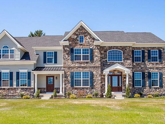 The Greenbrier Exterior Front Image Taken During the Afternoon New Home From Hallmark Homes