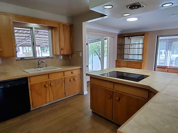 Kitchen view 2 - New tile countertops, backsplash and electric cooktop