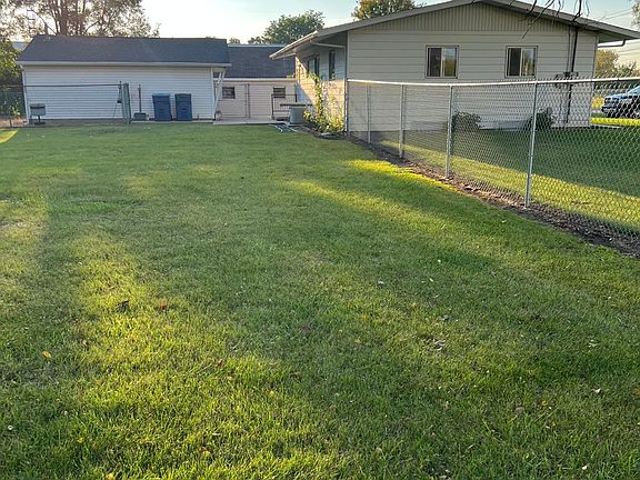 View of House & Garage from inside of fenced yard