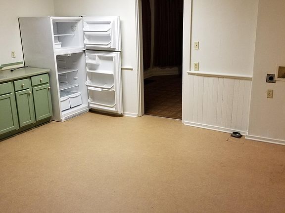 Kitchen, clothes washer and dryer hookups on right