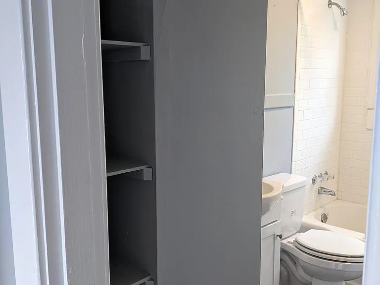 Bathroom view with shelving