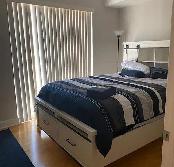 Second bedroom has sufficent space for a queen-sized bed, night-stand, and study desk. Bedroom furniture not included.