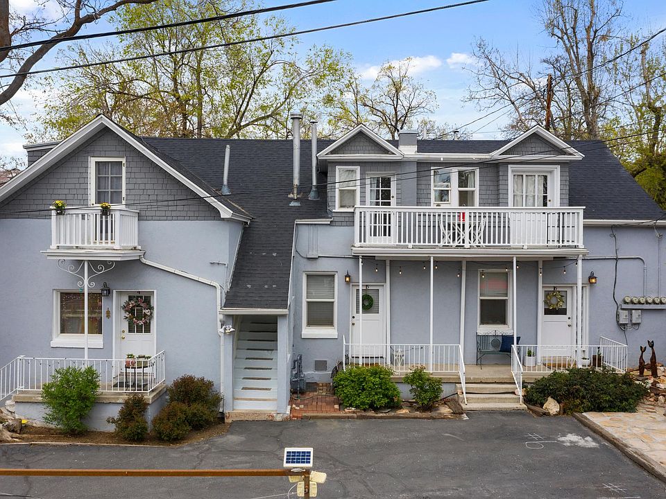 Front of the apartment building, private balcony on left of house.