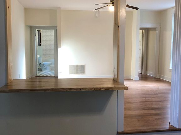 Modern, open- space living room and kitchen, with tons of natural light.