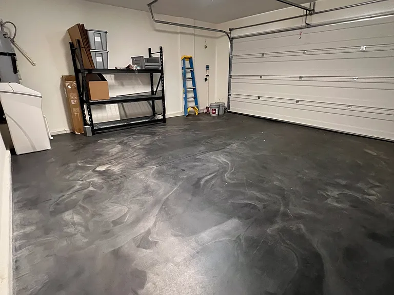Spacious two-car garage with a durable, finished epoxy floor