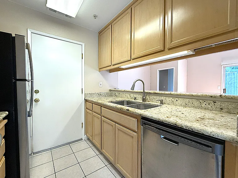 Remodeled Kitchen with
Granite Counters and Stainless Appliances