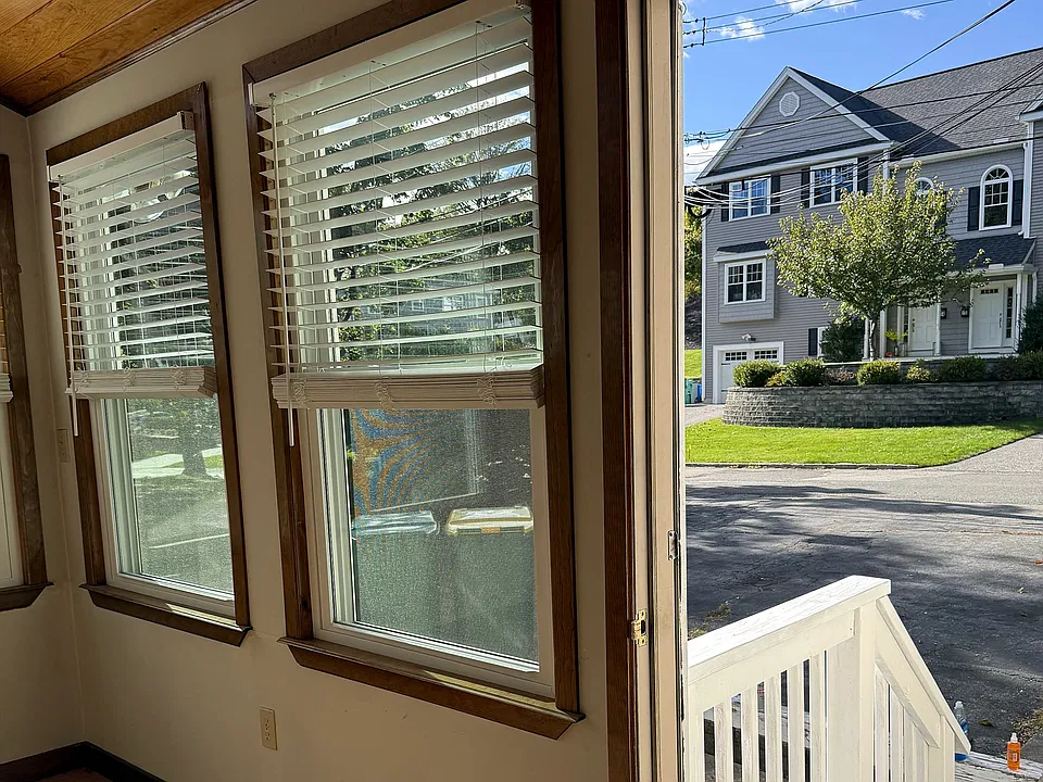 The sunroom faces the front driveway and Cummings Avenue.