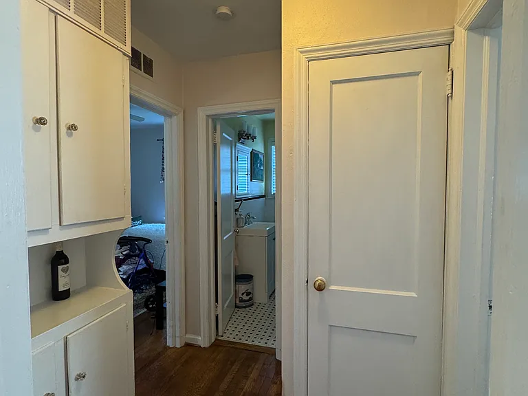 hallway leading to 2 downstairs bedrooms & downstairs bathroom