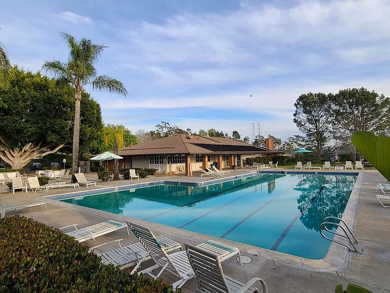 Seasonally heated Olympic sized pool, hot tub, BBQ and community center.