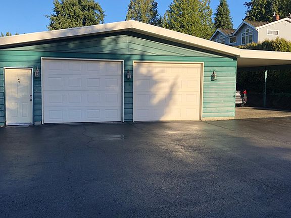 Extra Large two car garage with carport perfect for workshop.