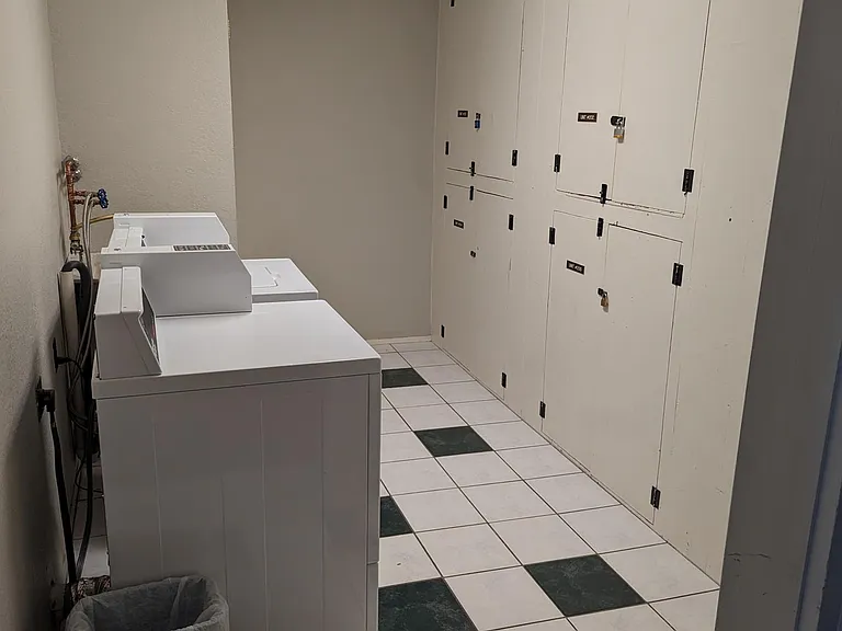 2nd floor laundry room with individual storage area for the unit.