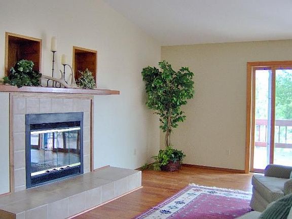 Greatroom has new wood flooring and gas fireplace.