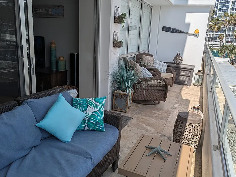 large balcony with sitting area