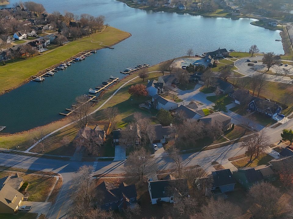 Steps away from the lake & pool! Don't miss this! Wonderful family home close to everything!