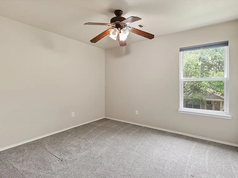 Bedroom 2 overlooking backyard