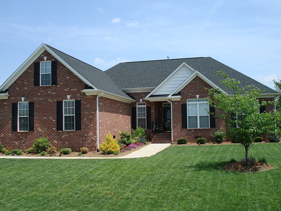 Home is on corner lot and features extensive landscaping.