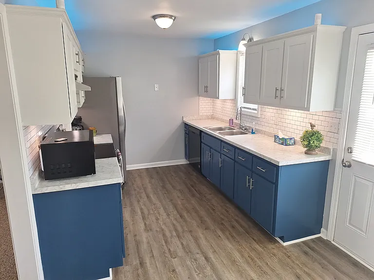 New kitchen flooring, above and below motion detected lighting. Lots of cabinet space!