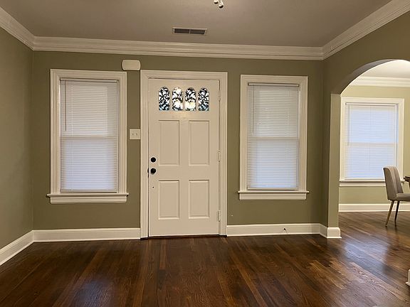 Front door, Newly repaired and refinished hard wood floors through out. Tile floor in Kitchen, Mud room and Laundry area.