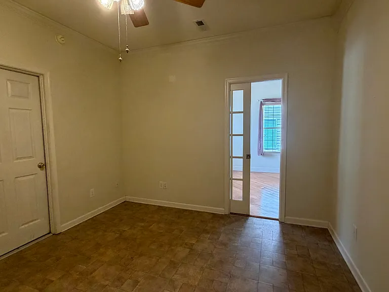 Office / playroom off living room with big closet