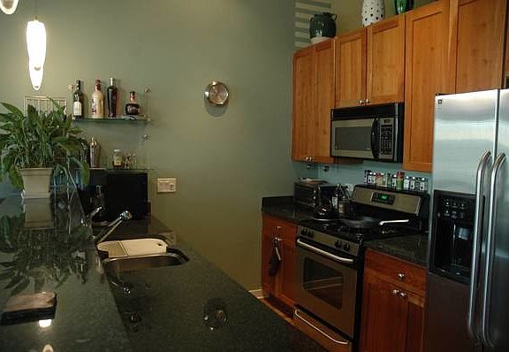 Galley Kitchen. Stainless Steel Appliances.