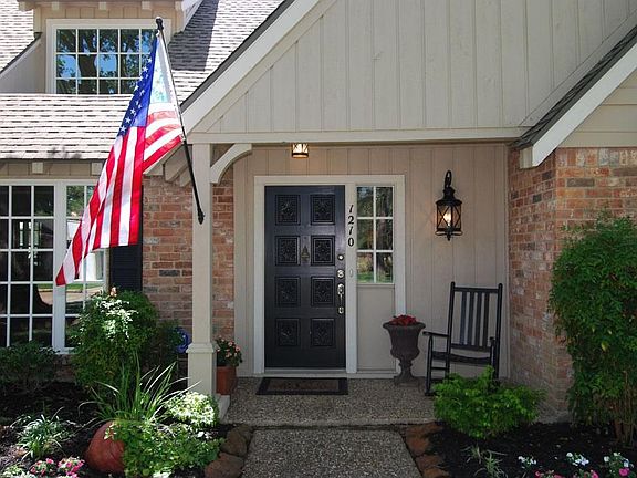 Covered entry porch, new roof 2011, new custom windows 2008.