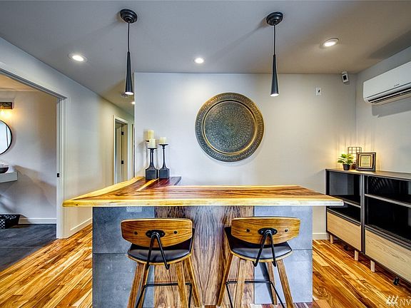 The interior of the building has a beautiful, cohesive aesthetic and special details, such as the live edge acacia desktop at the reception desk.  