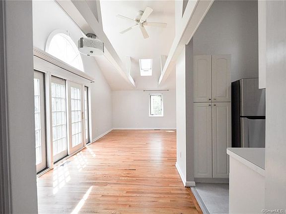 This is the view of the open floor plan dining/living area as it looks unfurnished. Spacious, light and bright!
