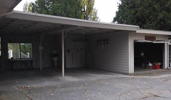 Double carport with enclosed garage, plus extra parking for