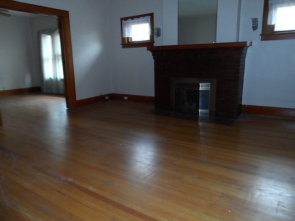 Original oak mantled brick fireplace