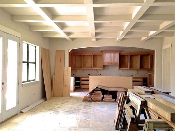 Custom built cabinets with crown molding. Shaker style painted white cabinet doors coming soon.