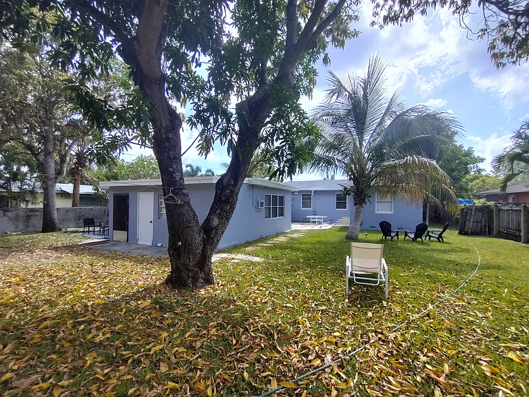 Back of the cottage with large yard