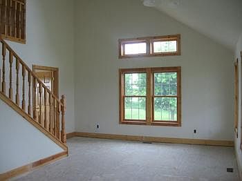 Large size living room has vaulted ceiling & skylight