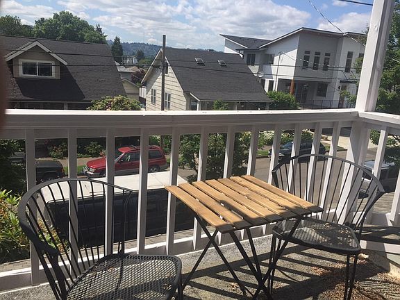 Balcony under with trellis and bistro table / chairs 