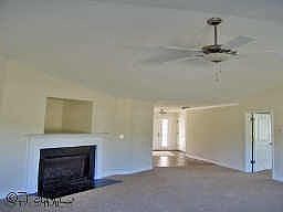 LARGE DEN WITH GAS LOG FIREPLACE AND ACCESS TO OUTSIDE PATIO