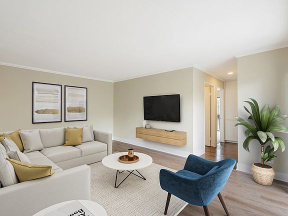Renovated Package I living room with hard surface flooring