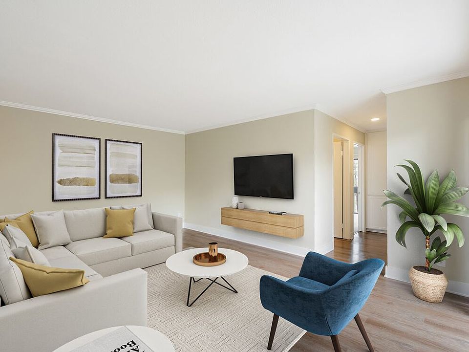 Renovated Package I living room with hard surface flooring