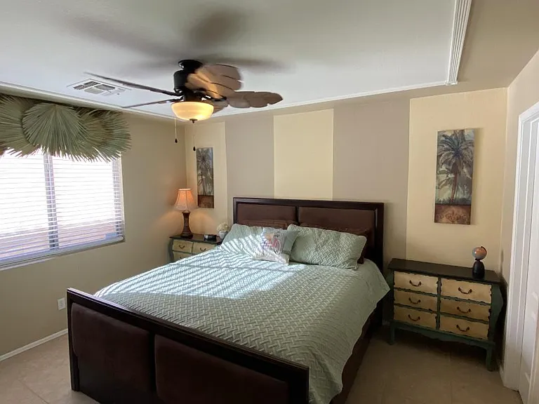 King in MASTER ENSUITE with unique ceiling plus custom paint, TV, walk-in closet and master ensuite!