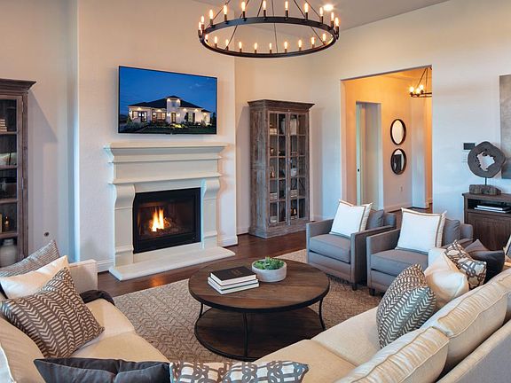 Great room with fireplace and upgraded lighting