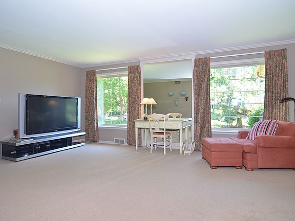 Living room with remote control drapes.