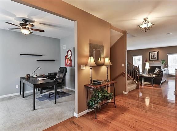 Entrance hall opens to den/study