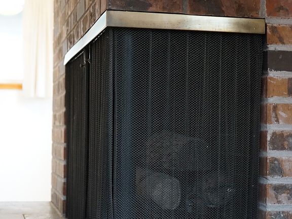 Gorgeous corner gas log fireplace