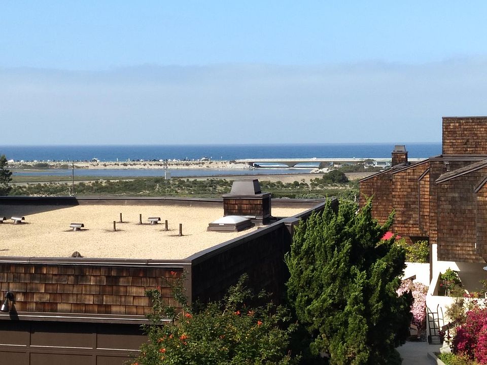 Oceanview from living room balcony - looking over another unit's garage. Slightly zoomed.