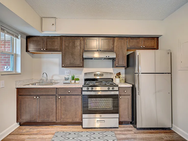 Updated Townhouse Style Apartments Featuring Carpeted Bedrooms, Neutral Paint Schemes, Granite Style Countertops, Hardwood Style Floors, Appliances, Spacious Closets, Matching Appliances Updated Townhouse Style Apartments Featuring Carpeted Bedrooms, Neut