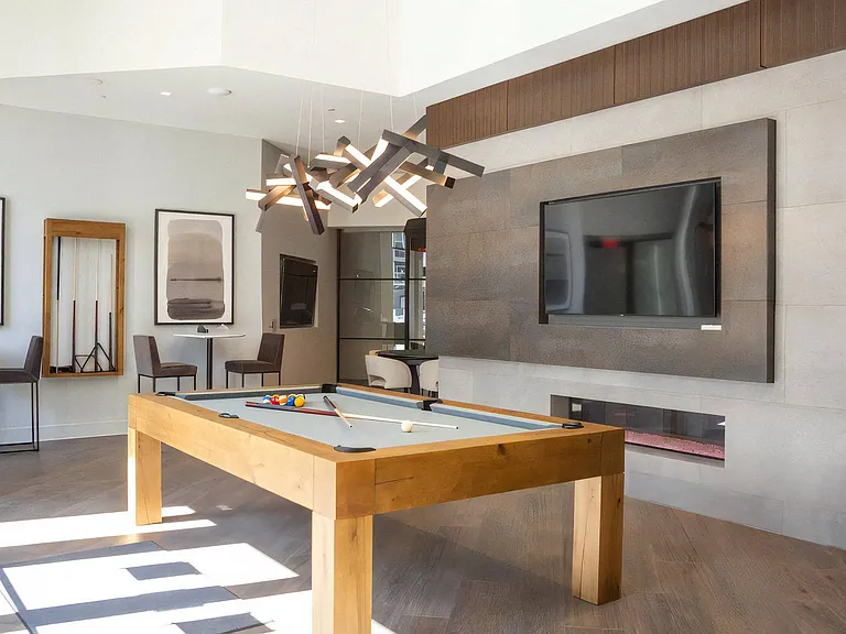 Lounge Area Featuring Cue Rack, High Chairs, and Billiards Table
