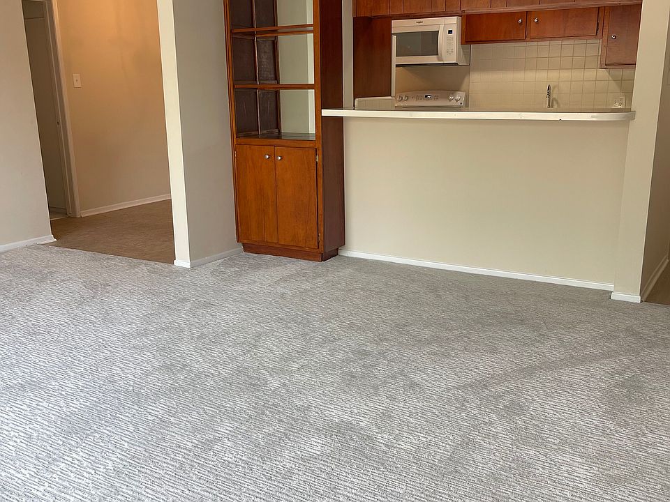 Living room to dining area, view to kitchen, breakfast bar